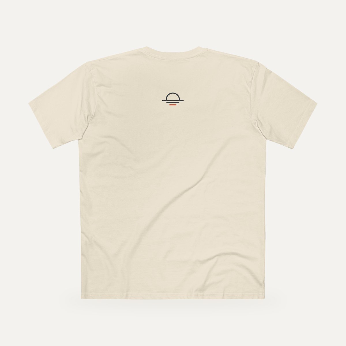 Back of the natural Clarity Over Chaos staple tee with the small icon
